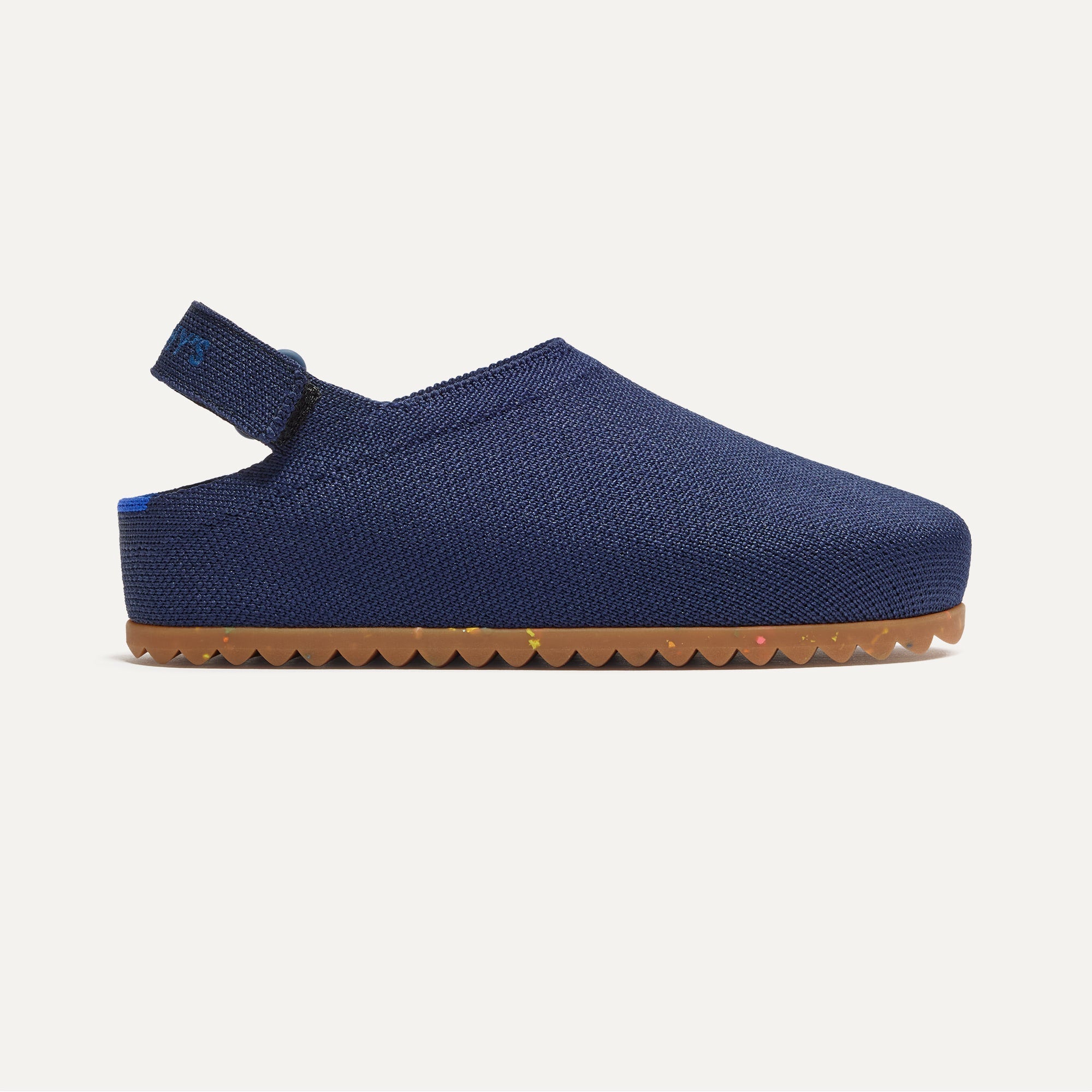 side | The Kids Clog in Deep Navy shown from the side. 