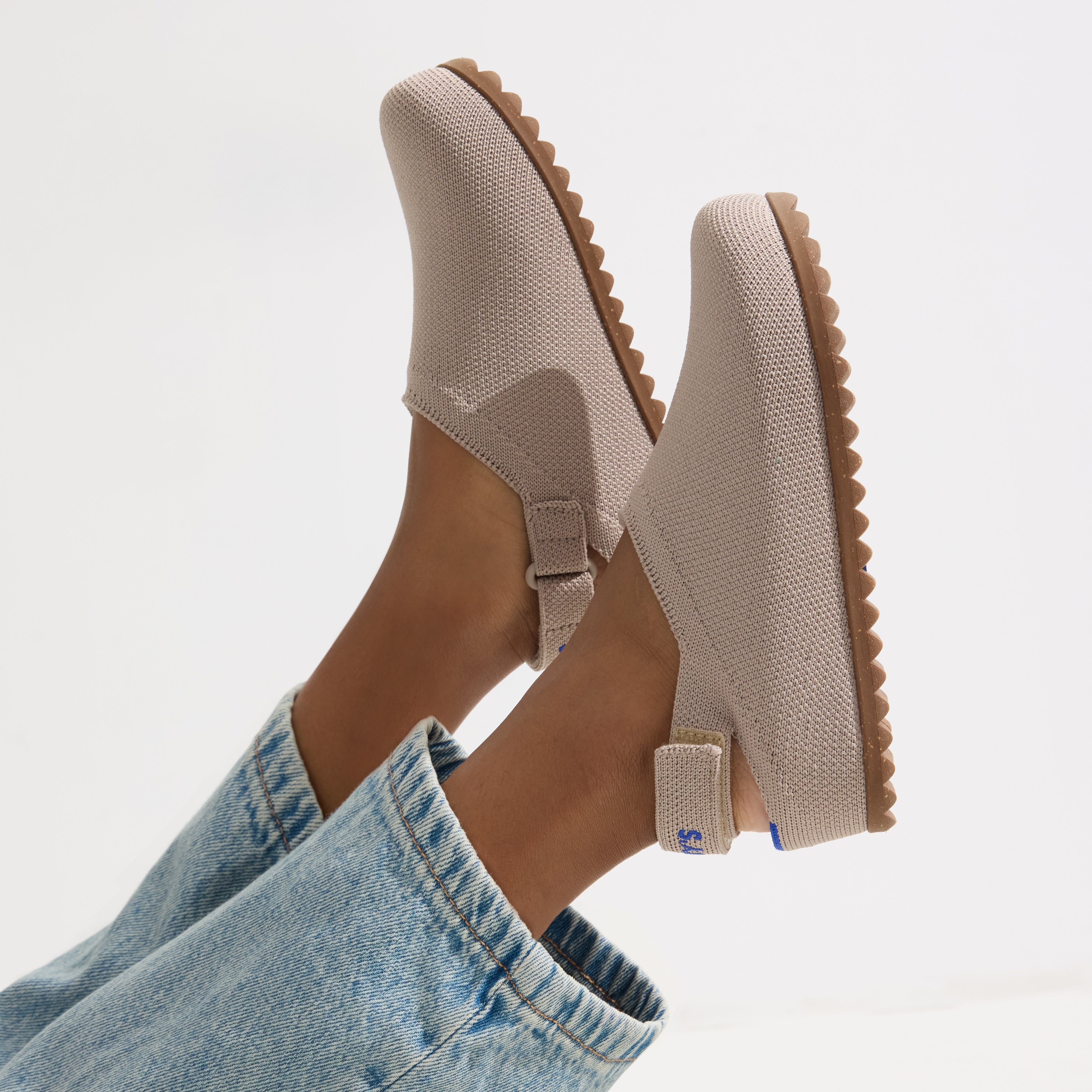 hover | A child wearing The Kids Clog in Dove. 