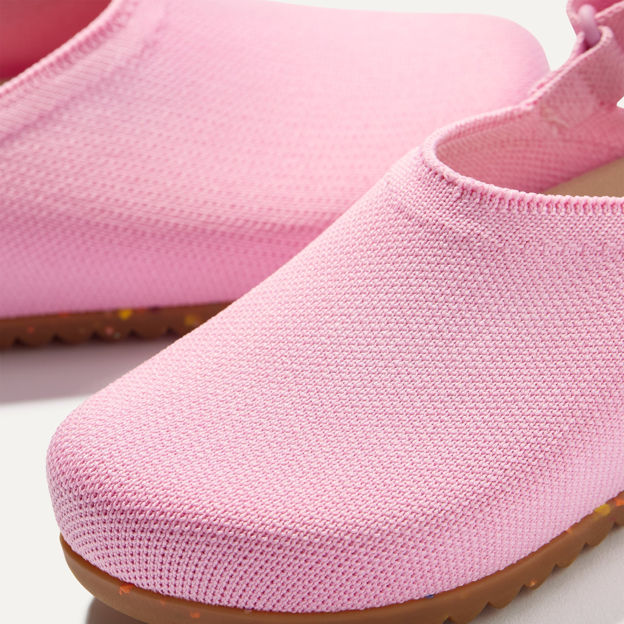 Close up of the rounded topline of The Kids Clog in Tutu. 