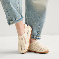 hover | A child wearing The Kids Clog in White Crochet. 