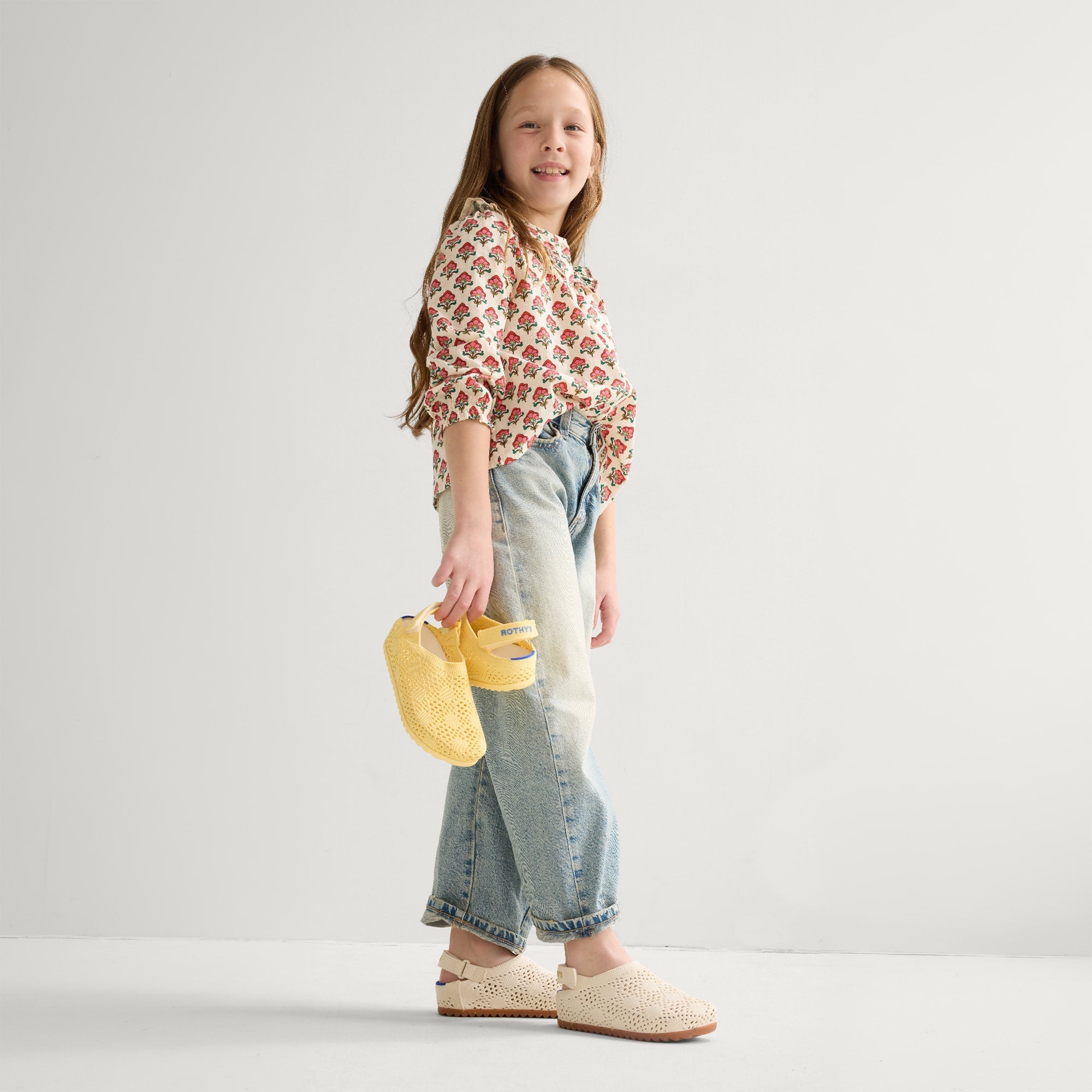 model | Alternate view of a child wearing The Kids Clog in White Crochet. 