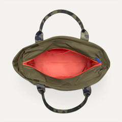 The Travel Tote in Forest, shown from above with the interior exposed.