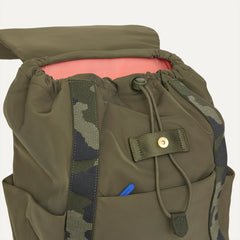 A close up of The Travel Cinch Backpack in Forest showing the drawstring closure.