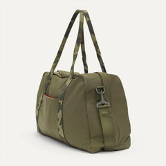 The Travel Duffle in Forest shown in diagonal view. 