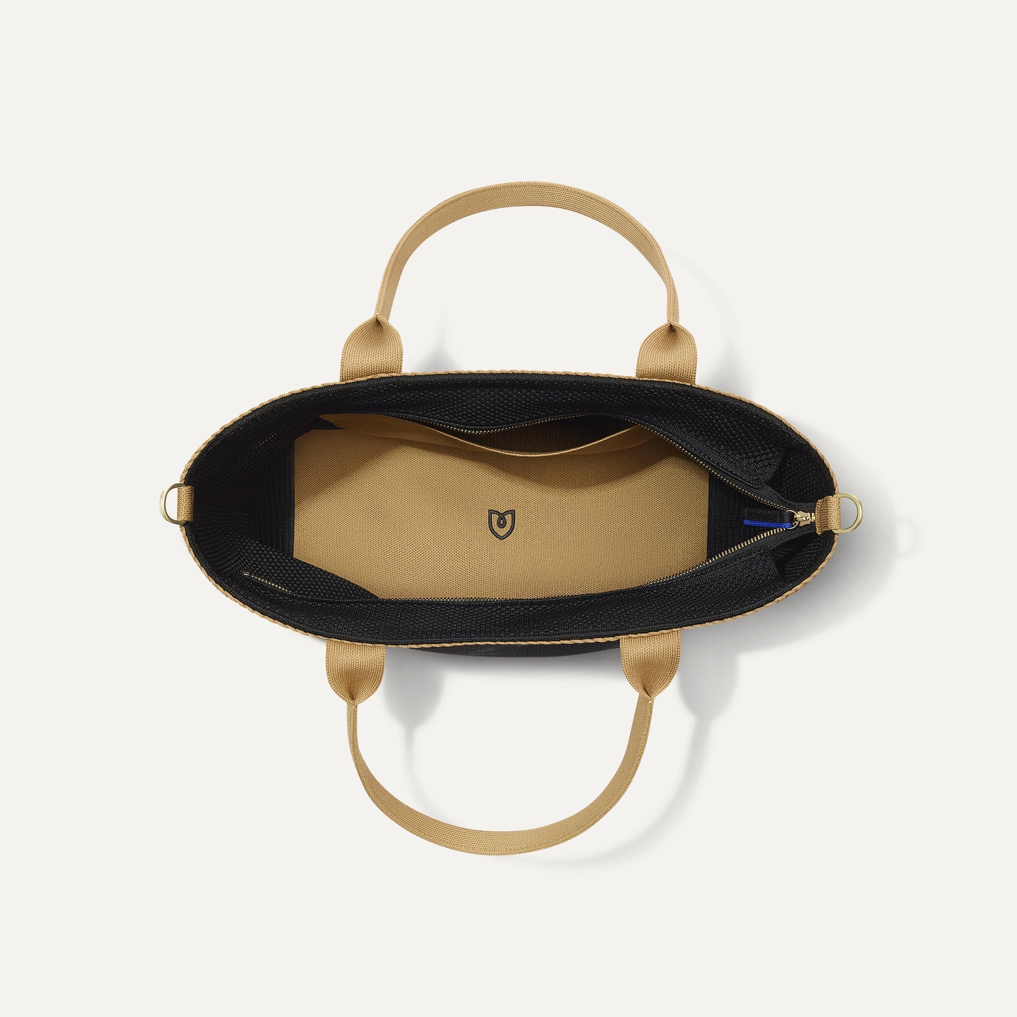 The Lightweight Zip Tote in Black Espresso Open-Knit, shown from above with the interior exposed.