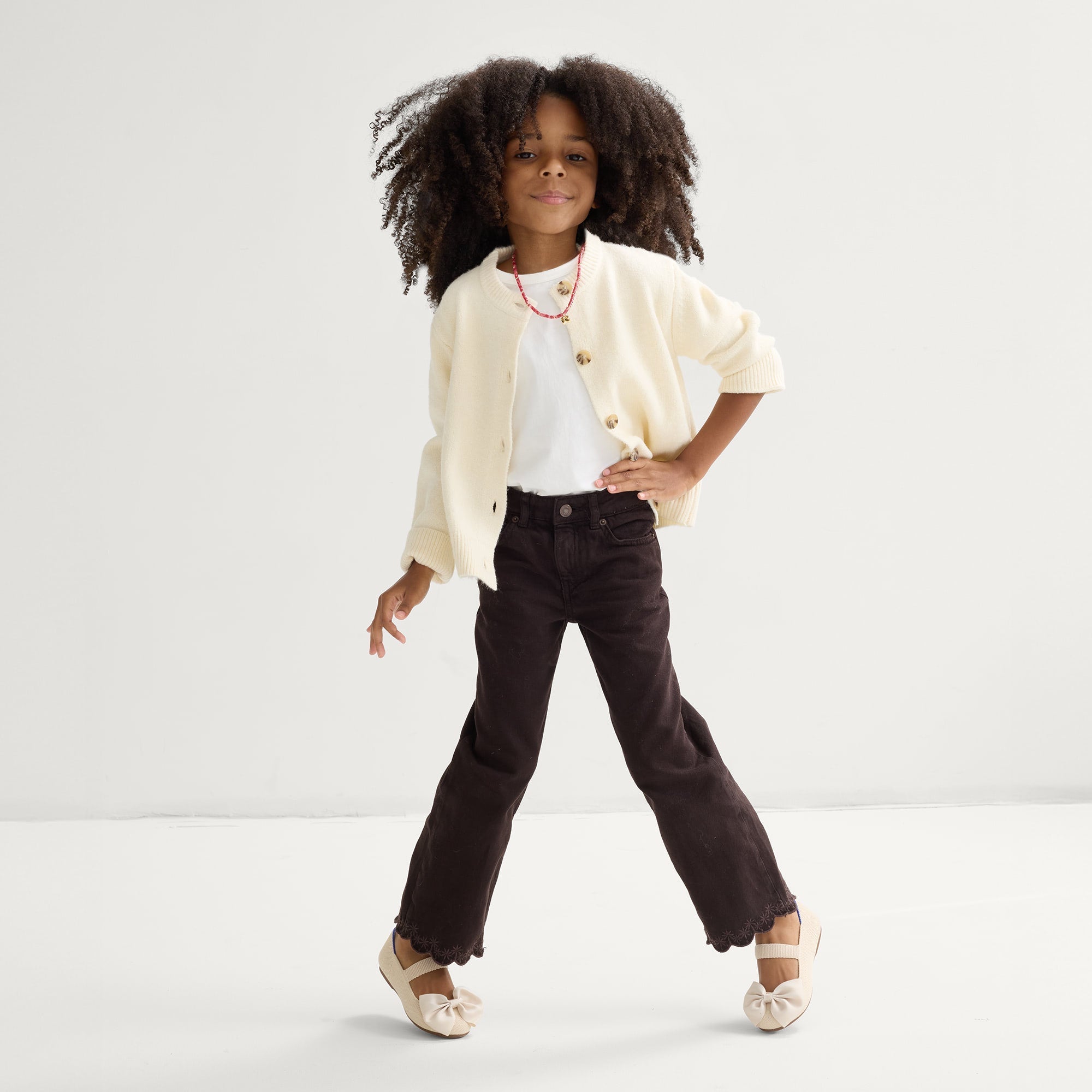 model | An alternate image of a model wearing The Kids Big Bow Mary Jane in Conch.