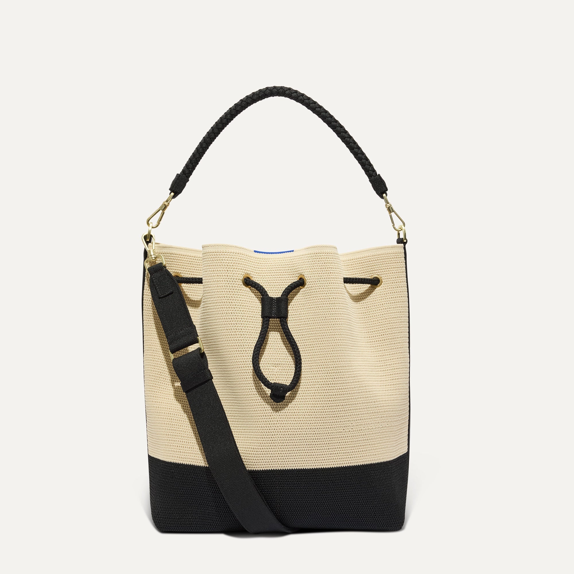 PLP |The Cinch Bucket Bag in Black and White Raffia-Knit shown from the front.