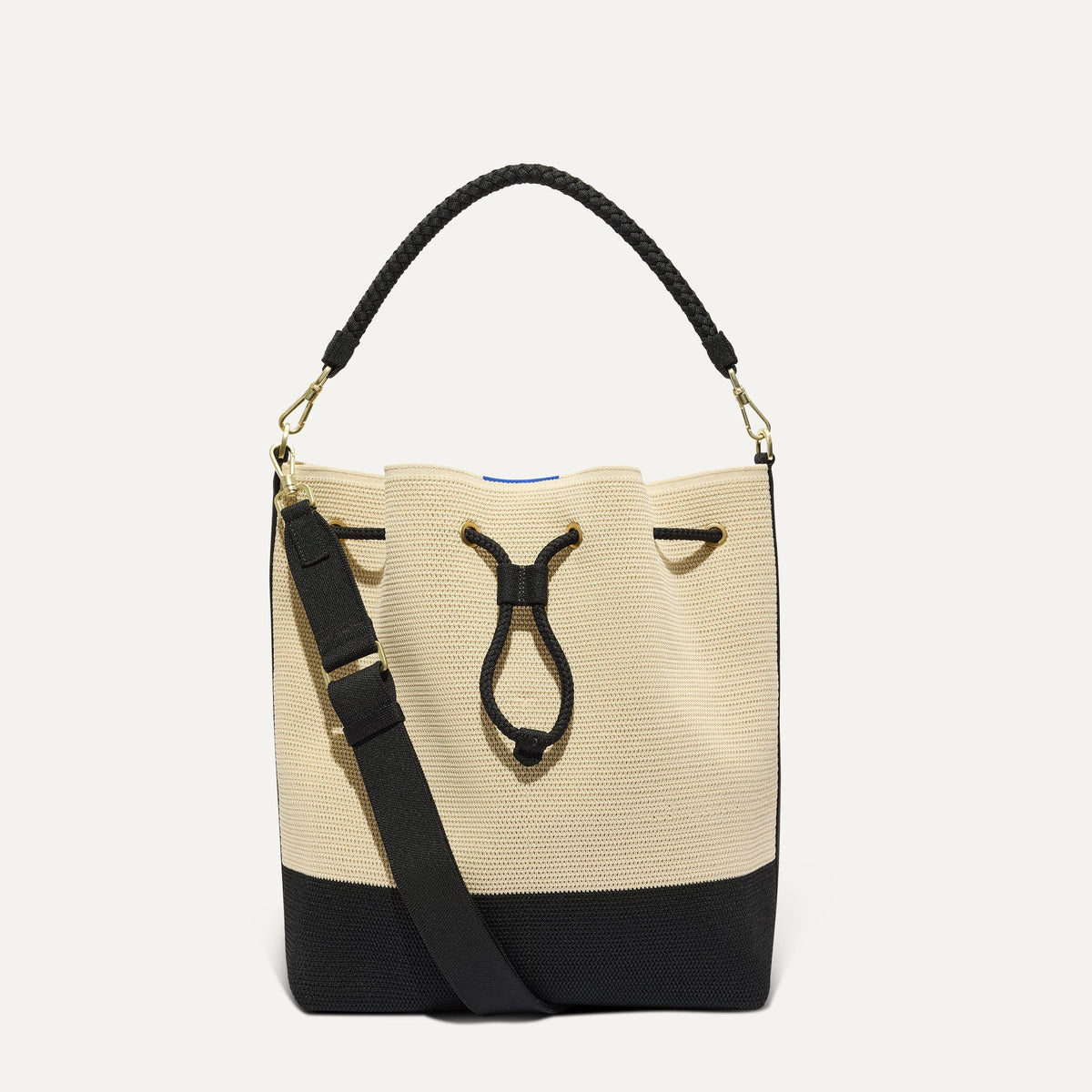 PLP |The Cinch Bucket Bag in Black and White Raffia-Knit shown from the front.