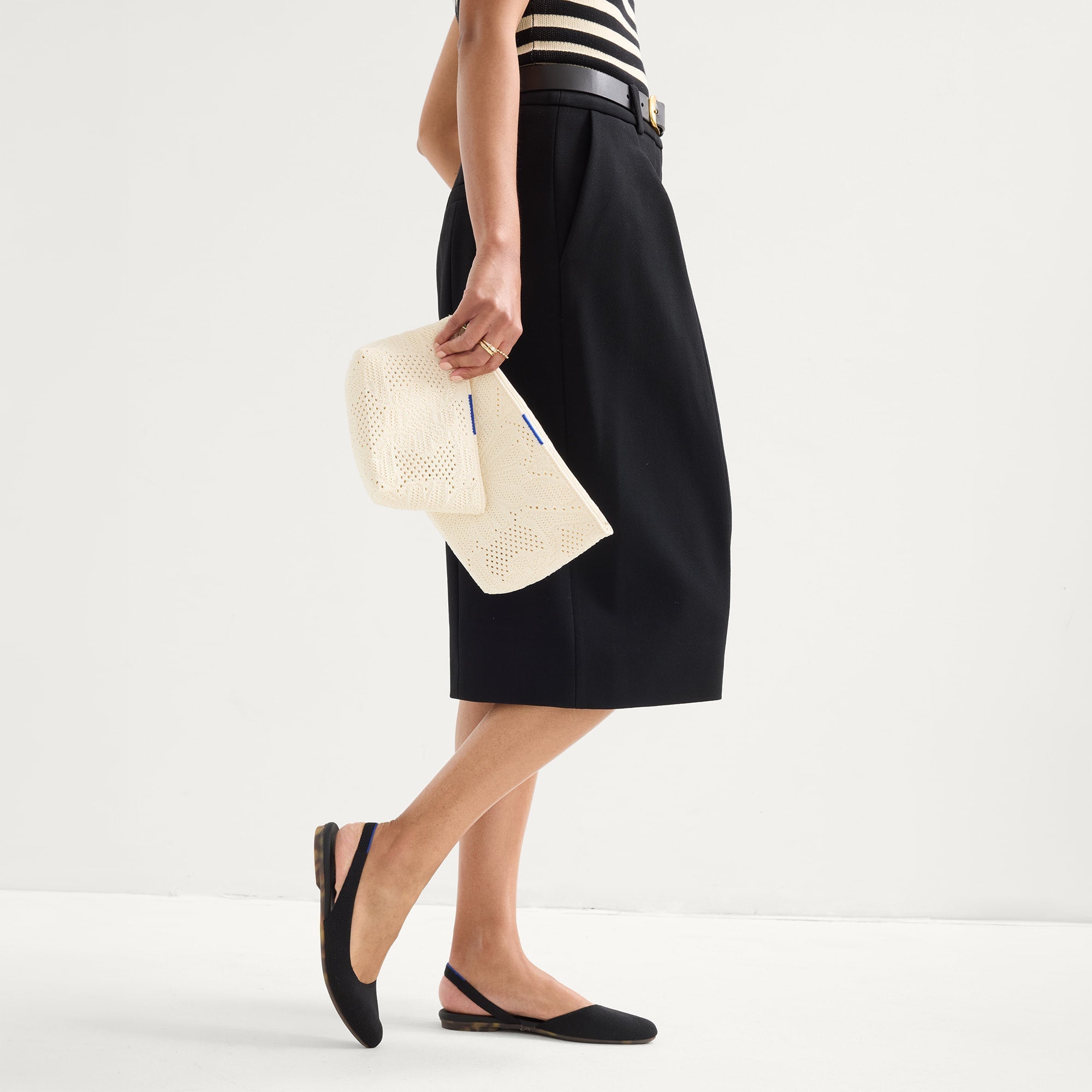 hover |Model shown holding The Travel Pouch Set in Moonflower shown from the front.