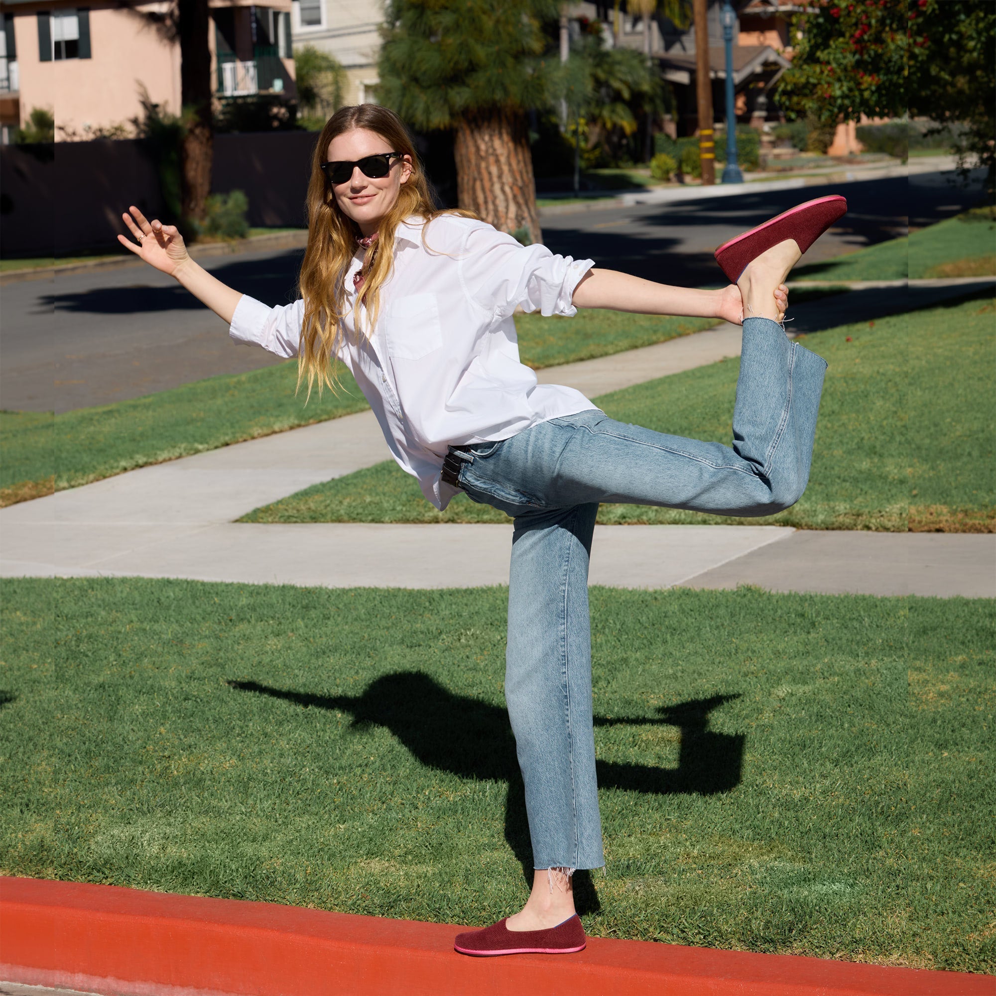 Another view of a model wearing The Cruiser Loafer in ReVelvet Cabernet.