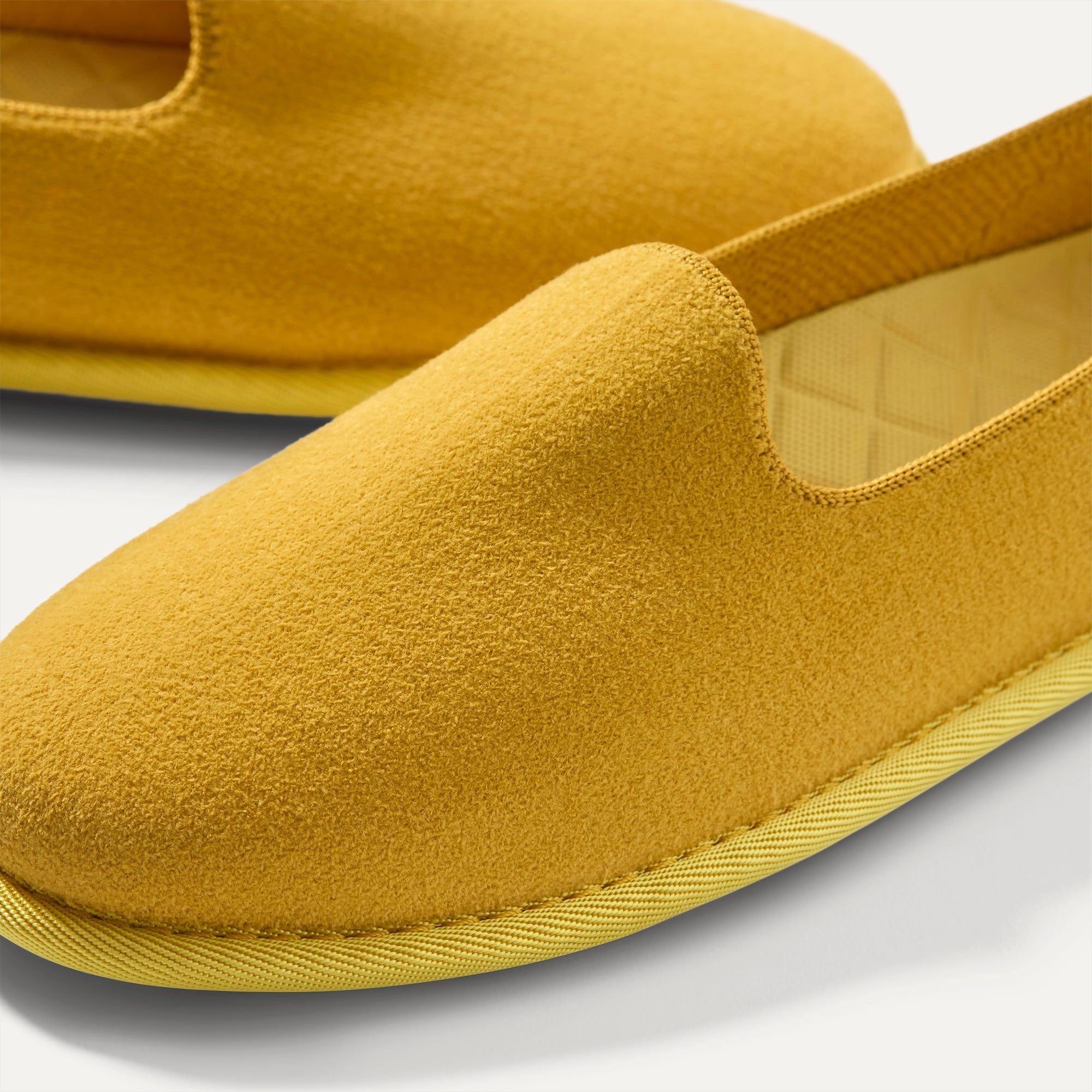 macro | The toe and vamp of The Cruiser Loafer in ReVelvet Saffron. 