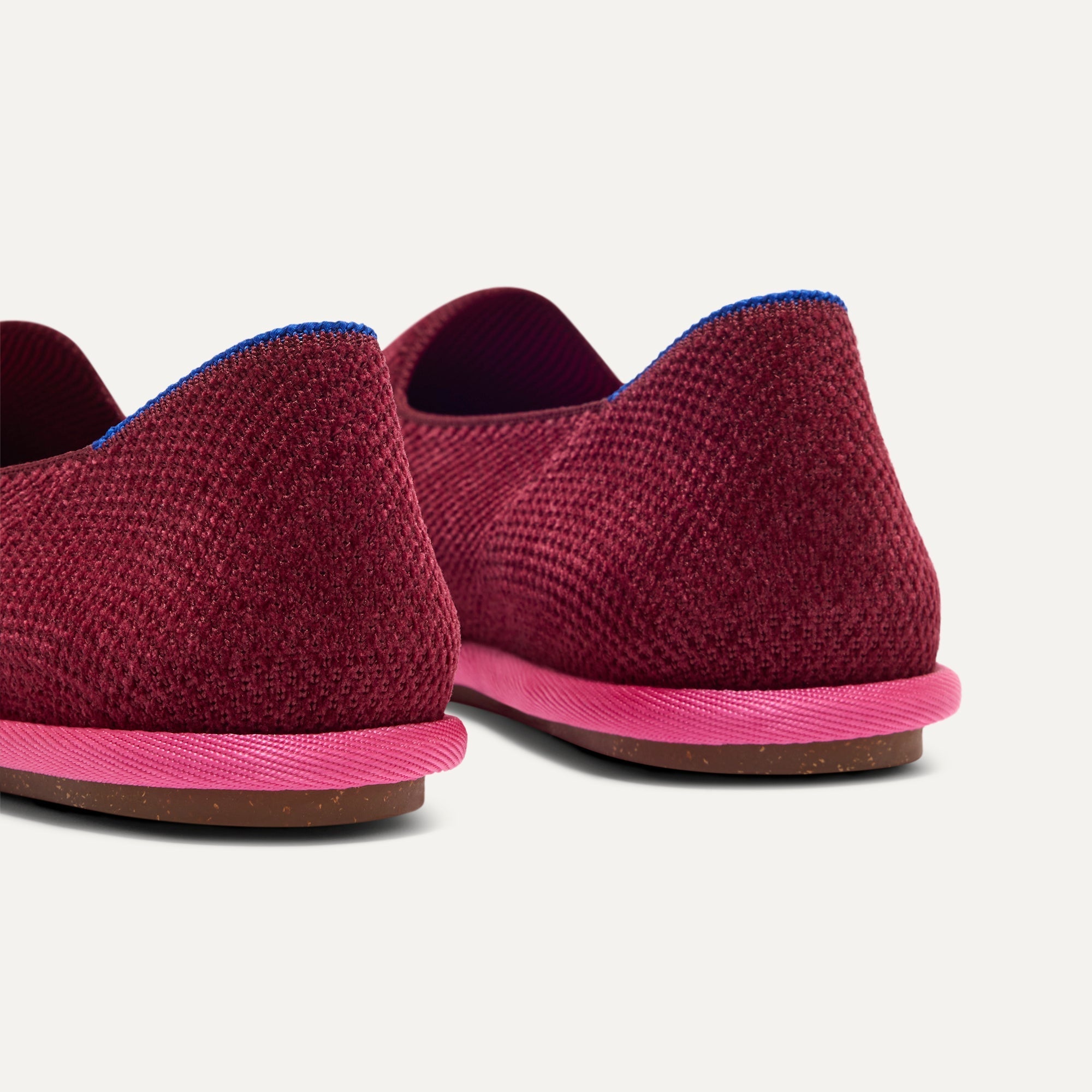 Close up of the heel of The Cruiser Loafer in ReVelvet™ Cabernet, with Rothy's signature blue halo. 