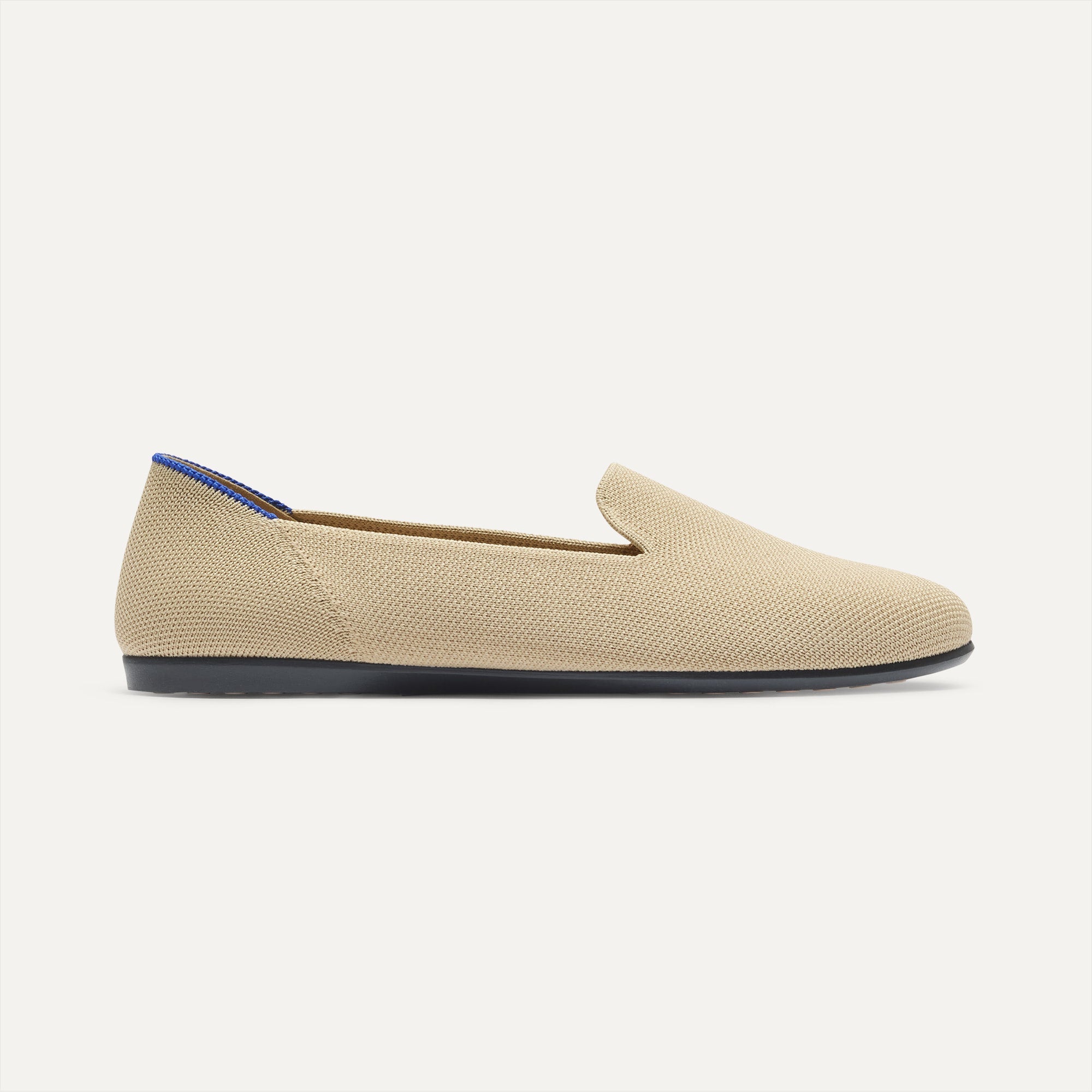 side | The Daily Loafer in Ecru shown from the side. 