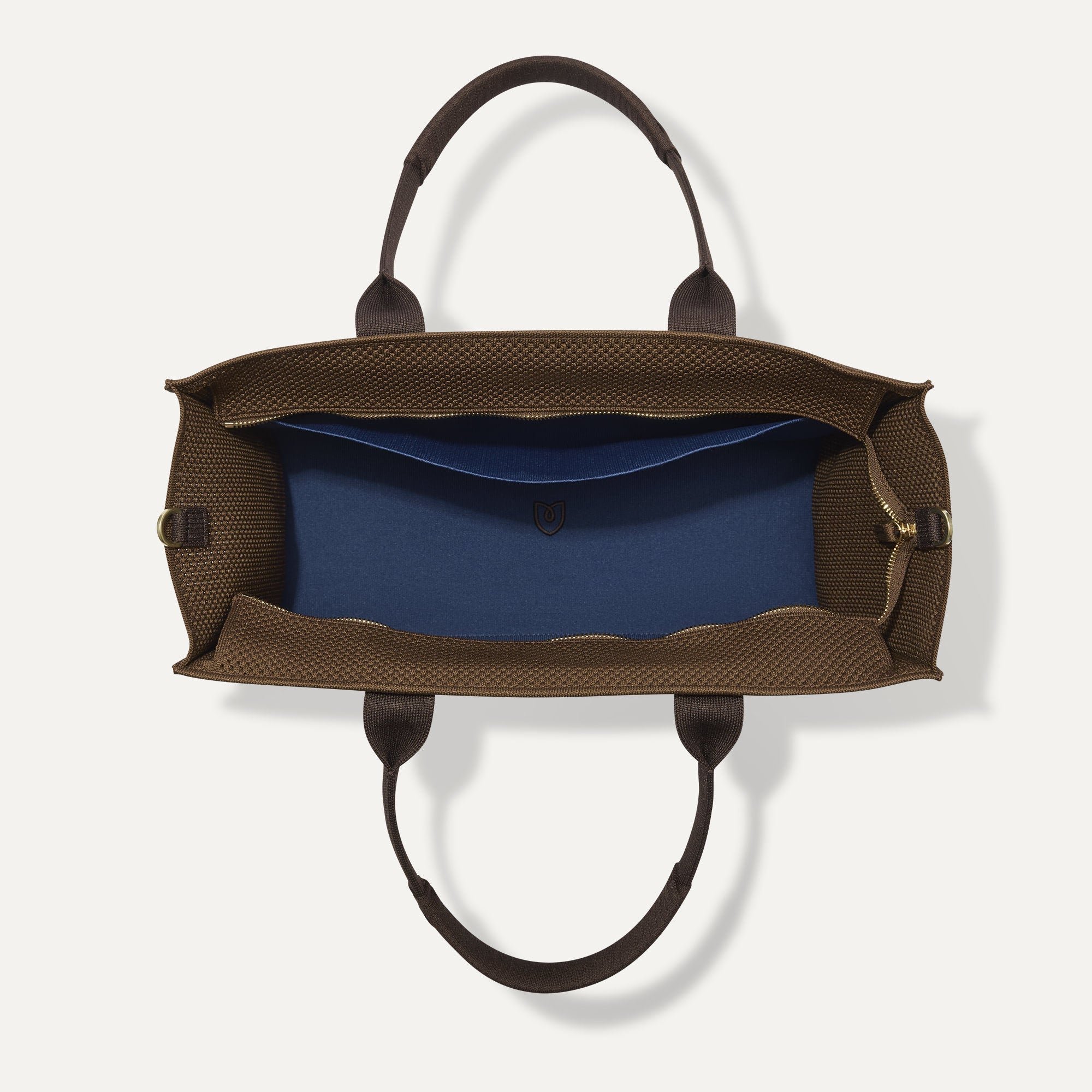 The Classic Tote in Cinnamon Open Knit, shown from above, with the interior exposed.