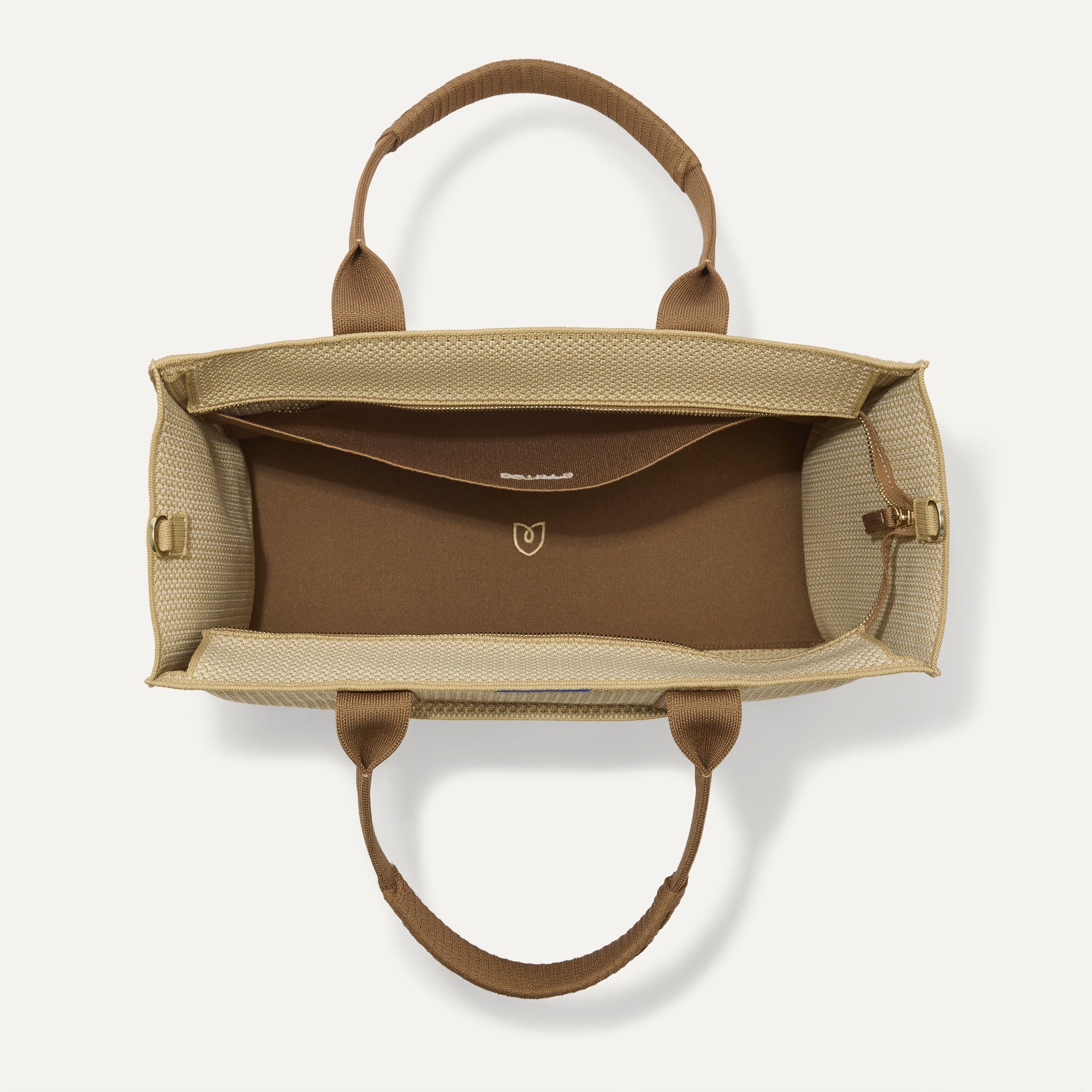 The Classic Tote in Macadamia Open-Knit, shown from above, with the interior exposed.