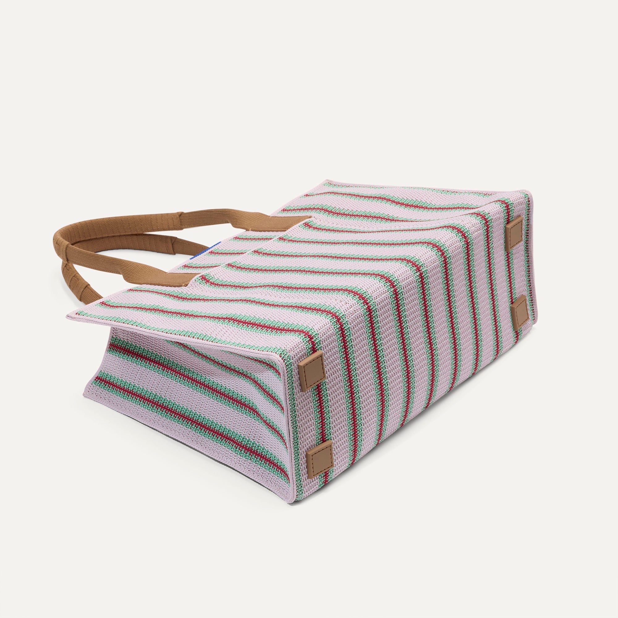 The Classic Tote in Watermelon Market Stripe, shown from the bottom. 