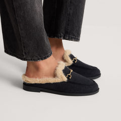 hover | Model wearing The Après Loafer Mule in ReVelvet Black.