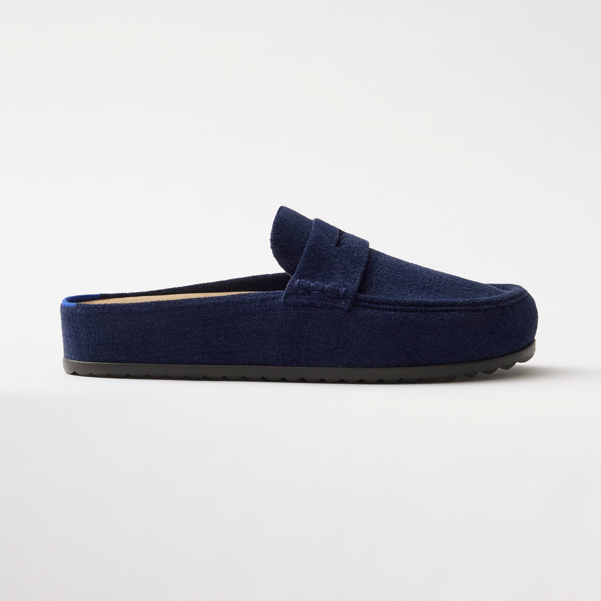 side | The Penny Clog in ReVelvet™ Navy shown from the side.