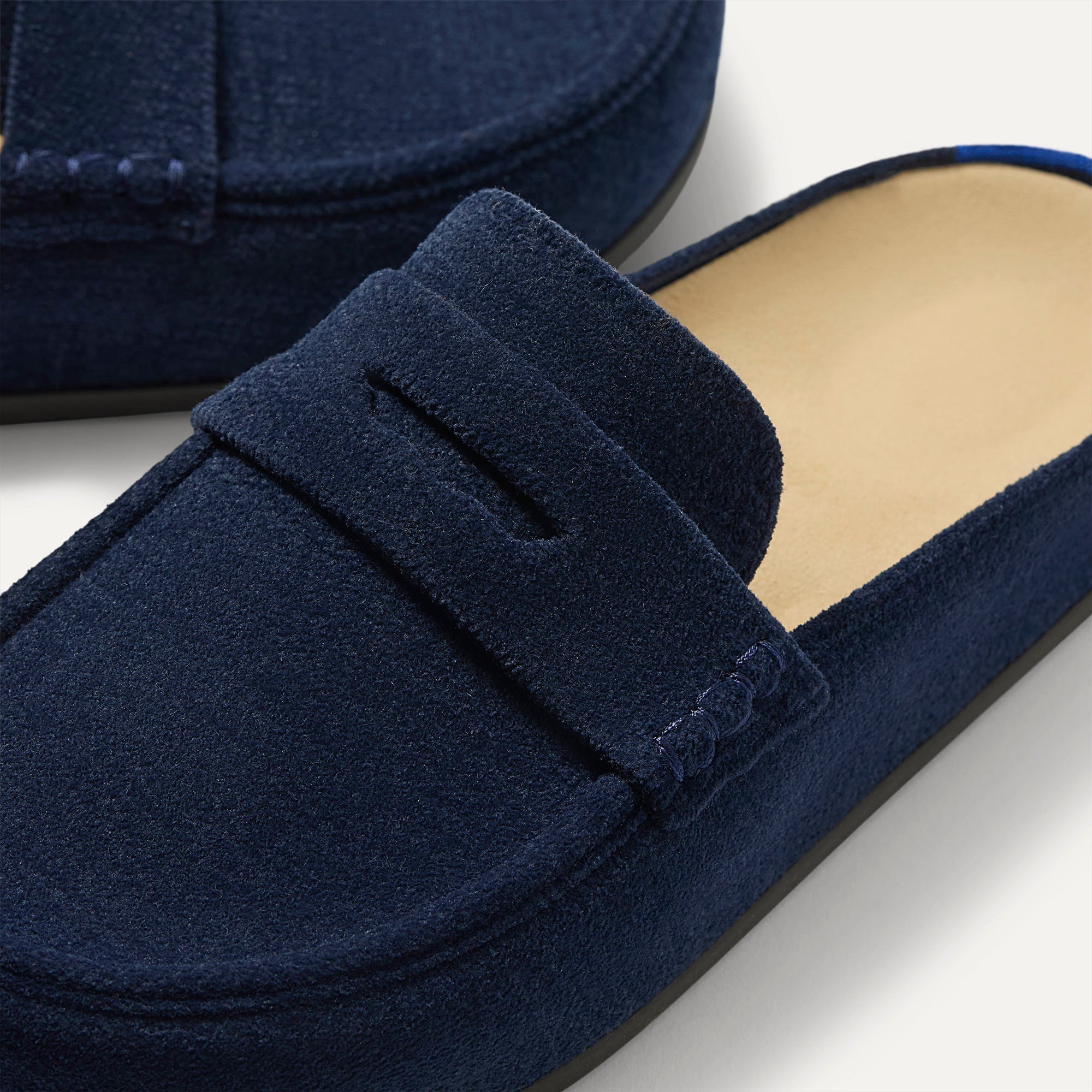 The toe and penny keeper detail of The Penny Clog in ReVelvet™ Navy. 