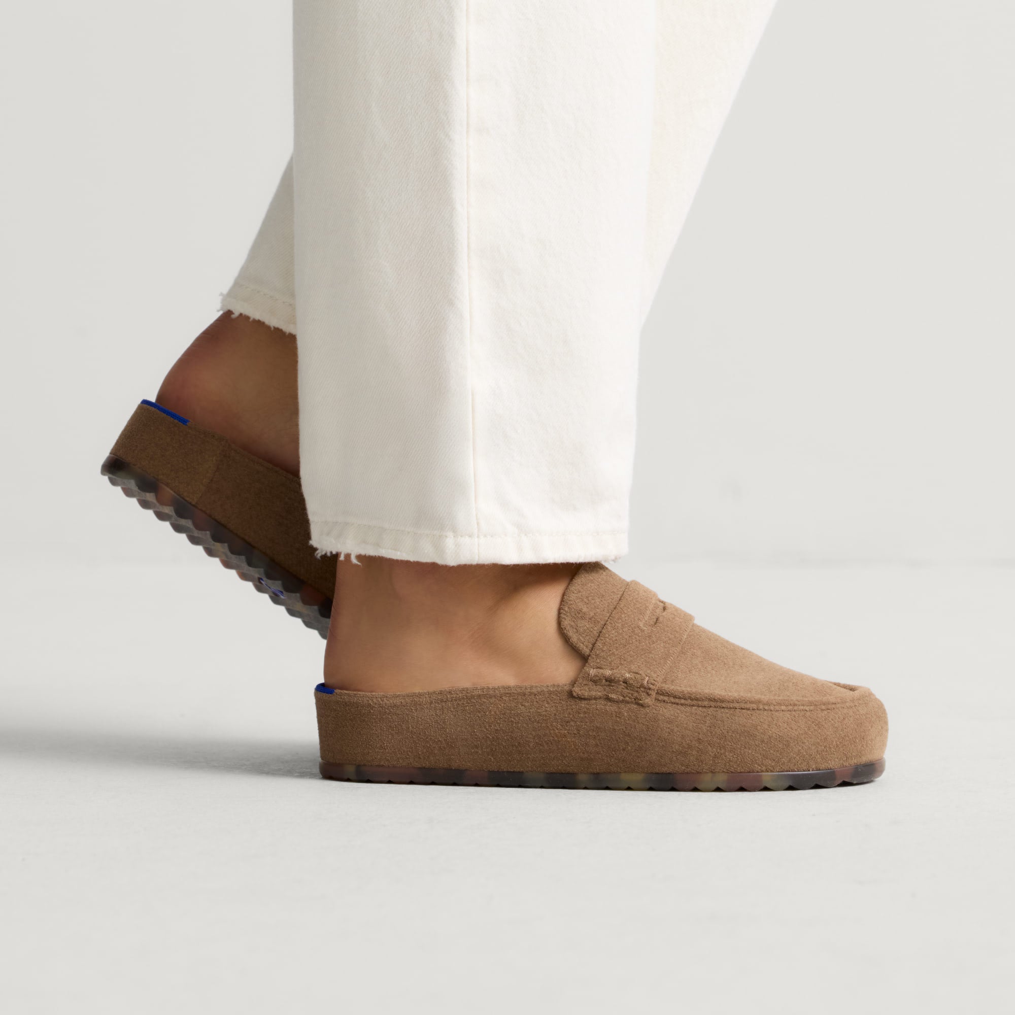 hover | Model wearing The Penny Clog in ReVelvet™ Portobello.