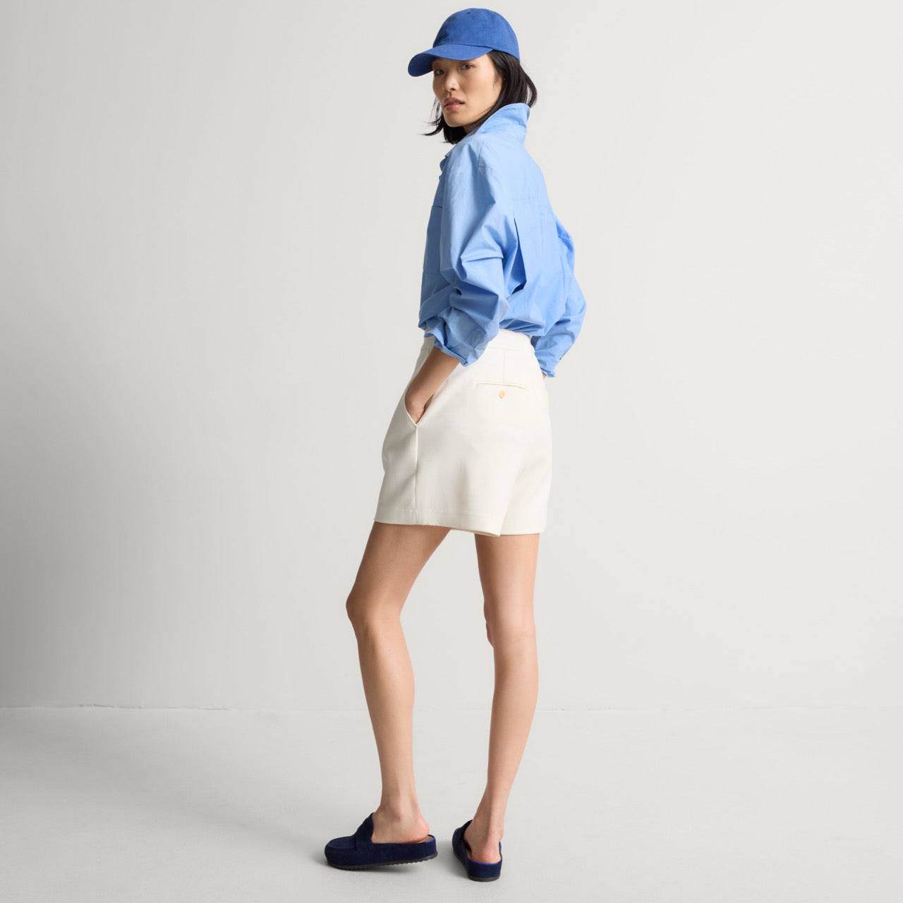 model | An alternate image of a model wearing The Penny Clog in ReVelvet Navy.
