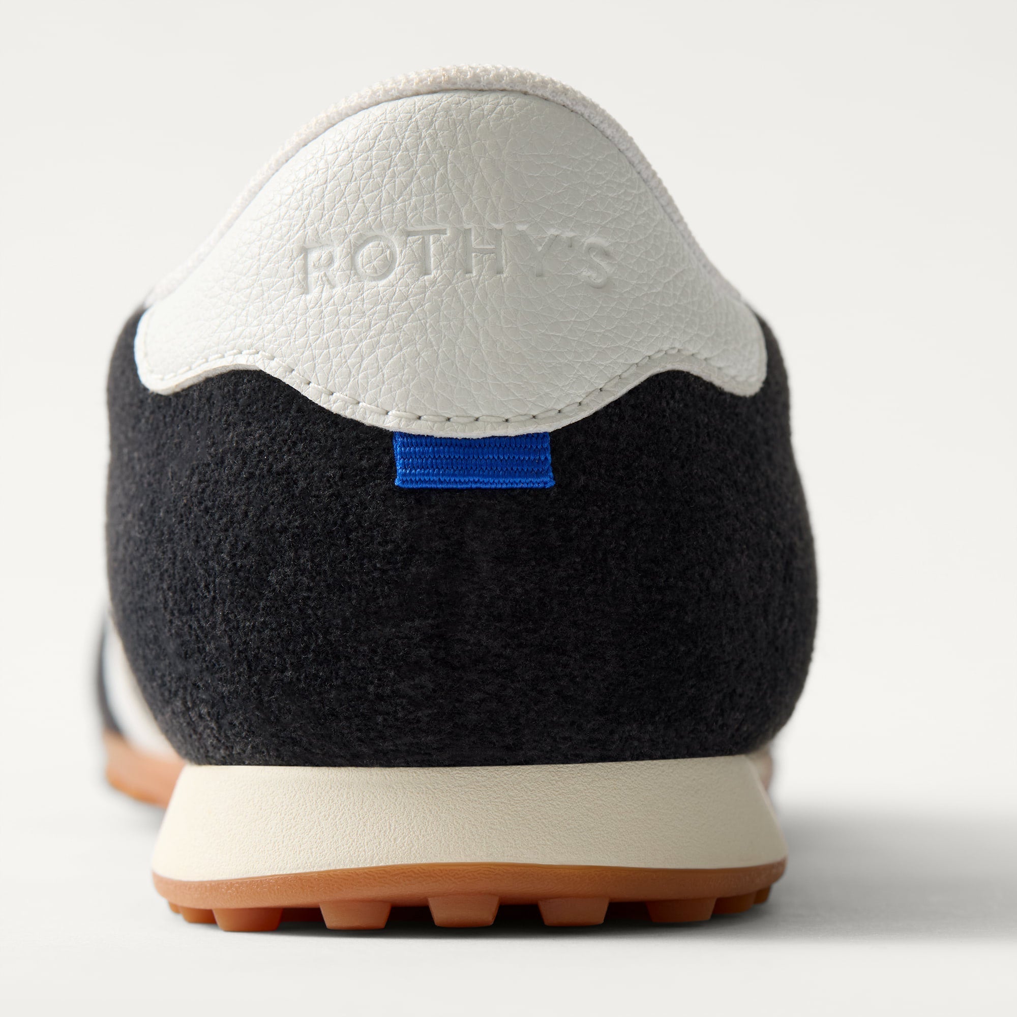 Close up of the heel of The Ivy Sneaker in ReVelvet Black.