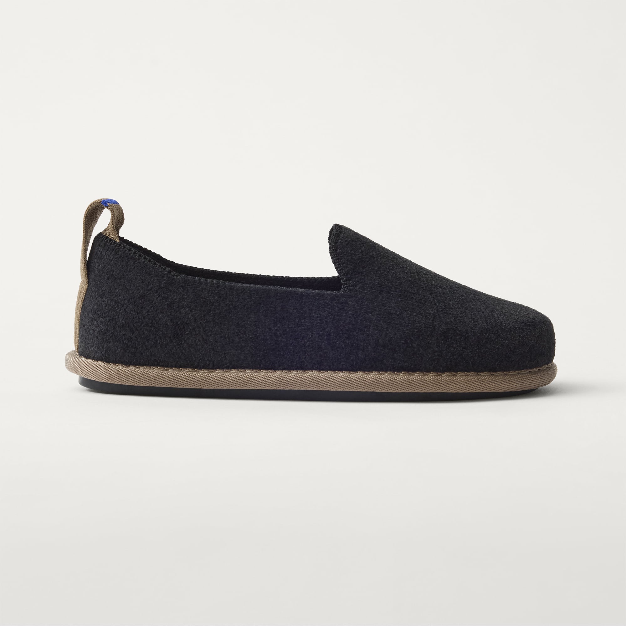 The Mini Loafer in ReVelvet™ Black shown from a side view showing the outsole.