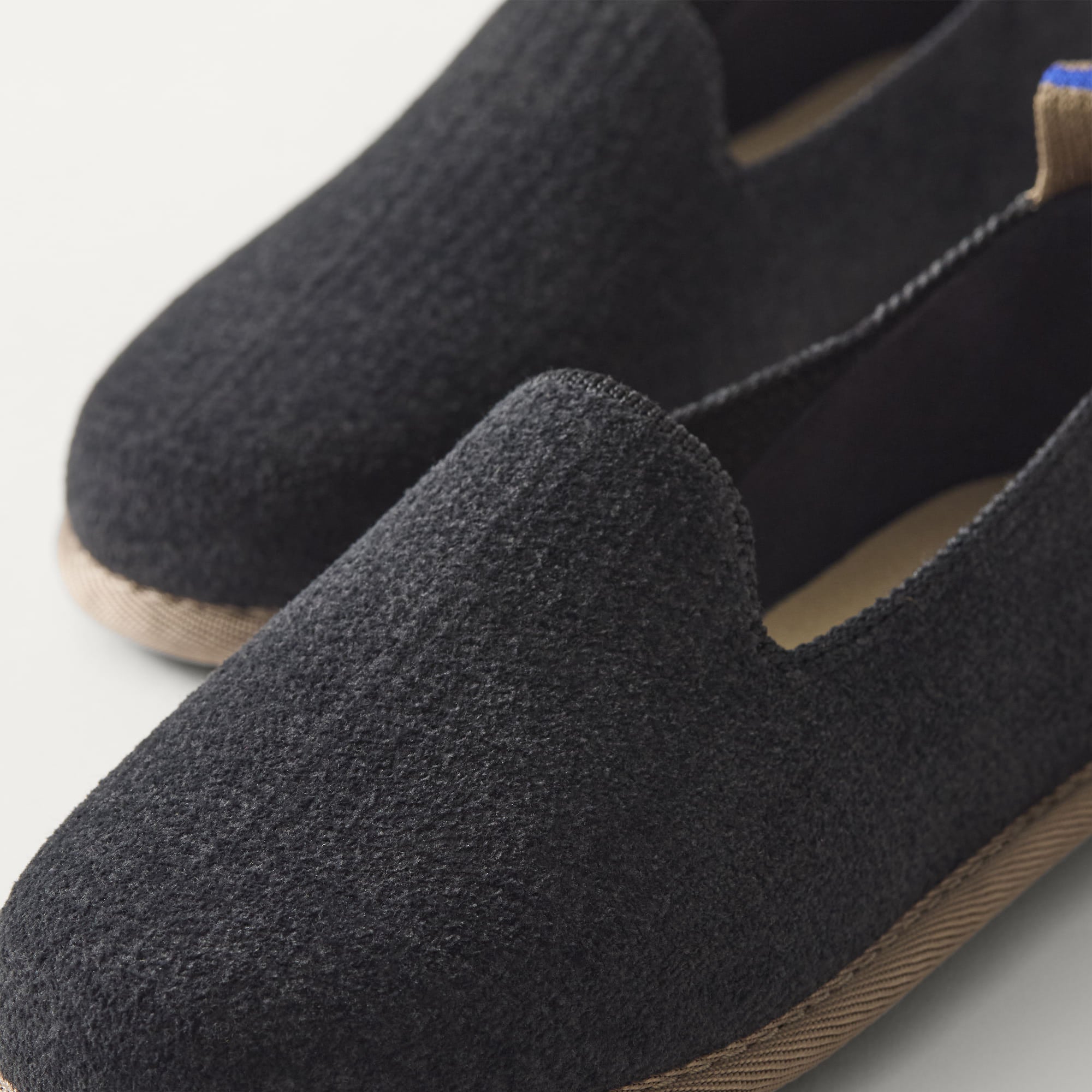 The Mini Loafer in ReVelvet™ Black view with detailing of the front of the shoe.