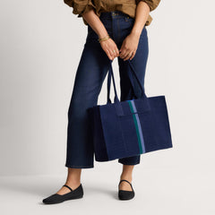 hover | The Classic Tote in ReVelvet Peacock, worn over the shoulder by a model, shown from the side.