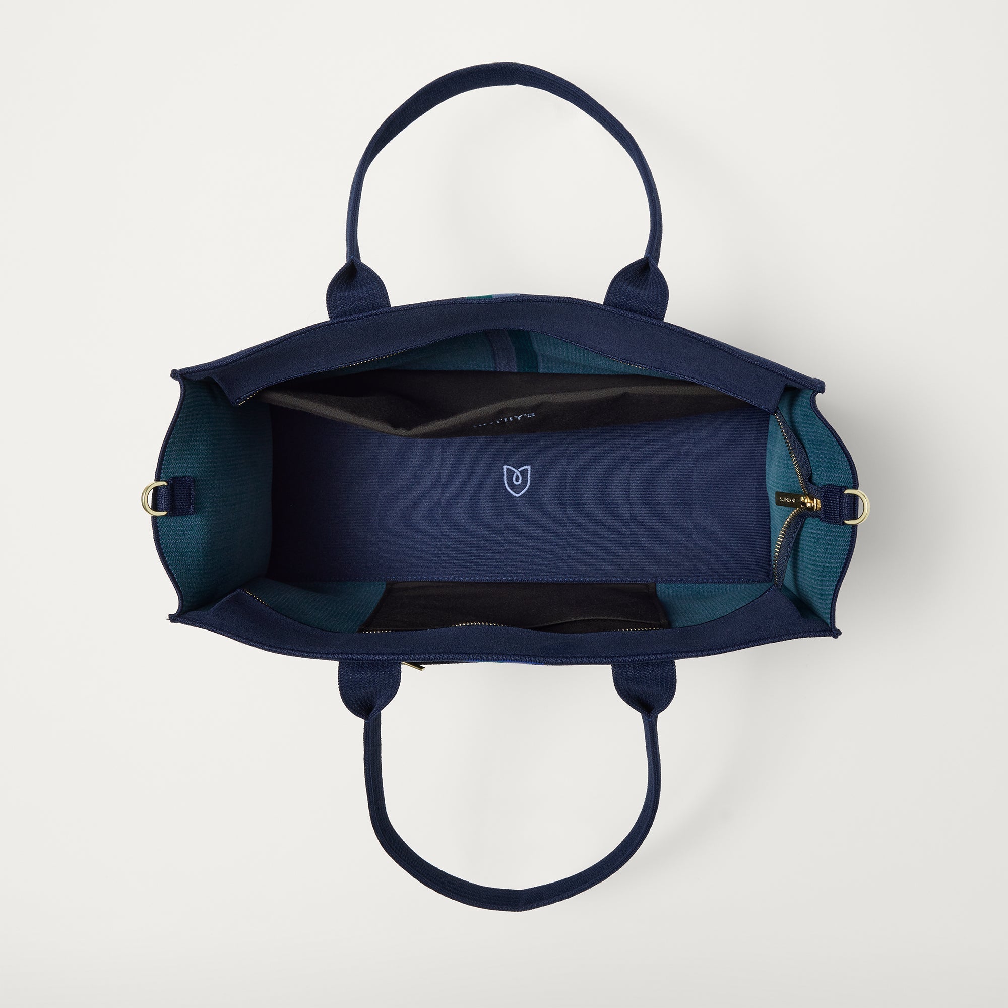 The Classic Tote in ReVelvet Peacock, shown from above, with the interior exposed.