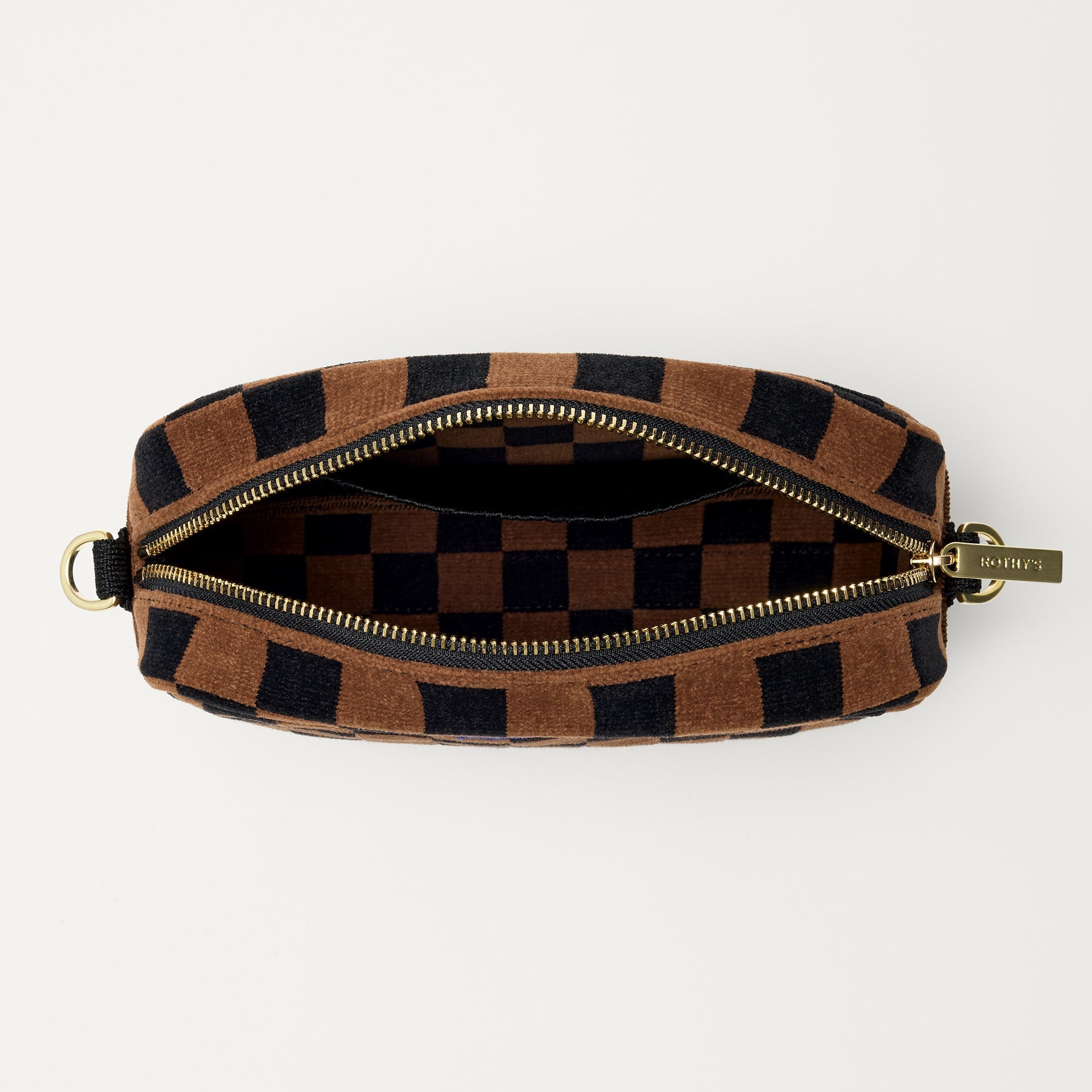 The Crossbody Camera Bag in ReVelvet™ Umber Check, shown from above, with the interior exposed.