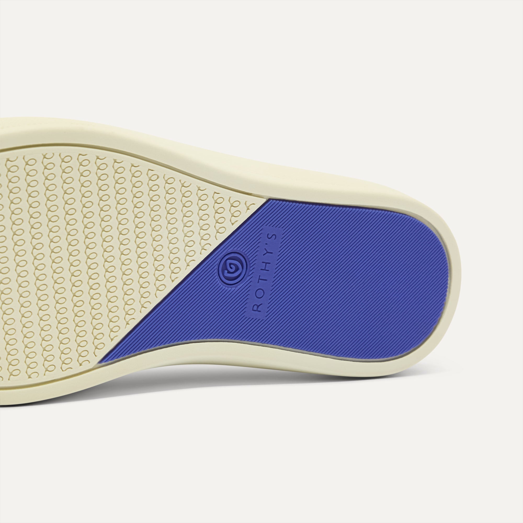The sole of The Kids Strap Sneaker in Buoy Open-Knit.